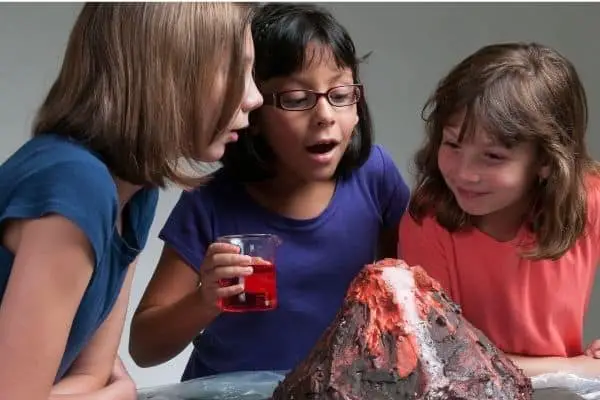 Children excited with baking soda volcano experiment