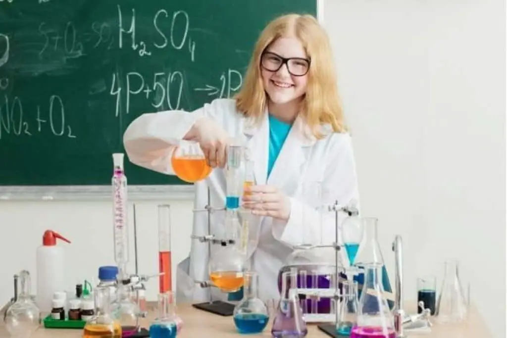 Girl holding flask for chemistry experiment