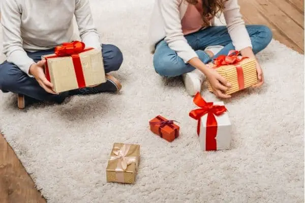 Children holding unopened gifts