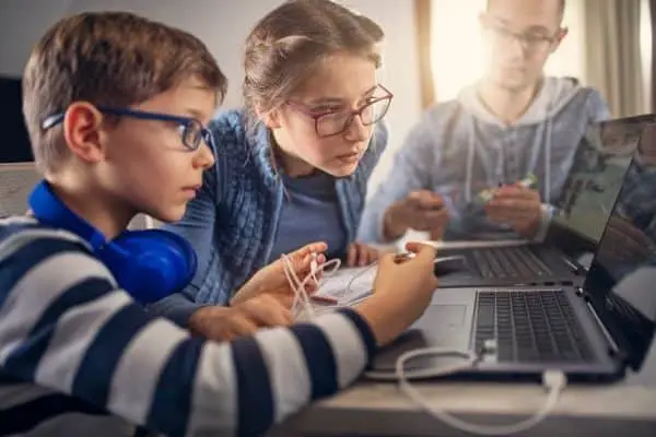 Kids focused on how to learn coding