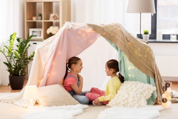 Children Playing In Diy Fort At Home