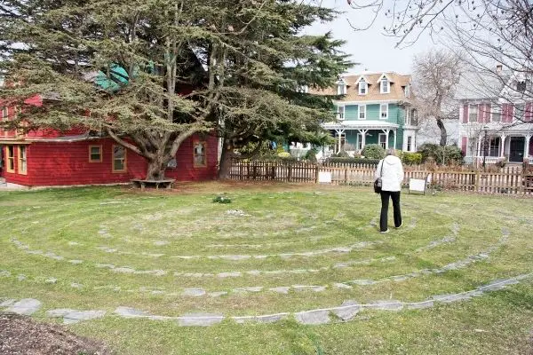 Woman walking in the labyrinth in backyard