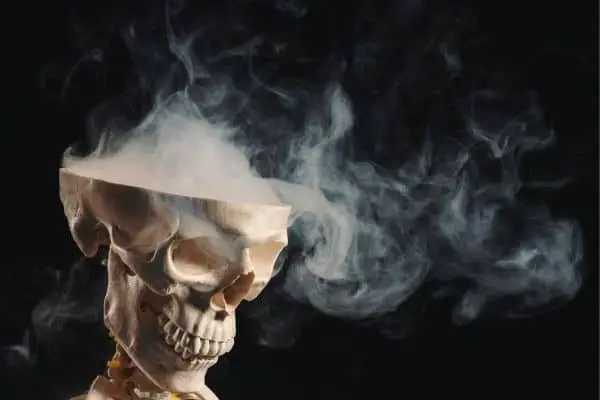 Half-open Halloween skull with smoke coming out
