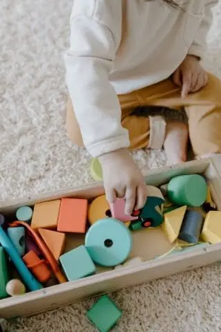 Toddler Playing With Some Montessori Blocks